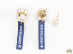 Blue silicon lapel drops with branding on pearl bomber studs