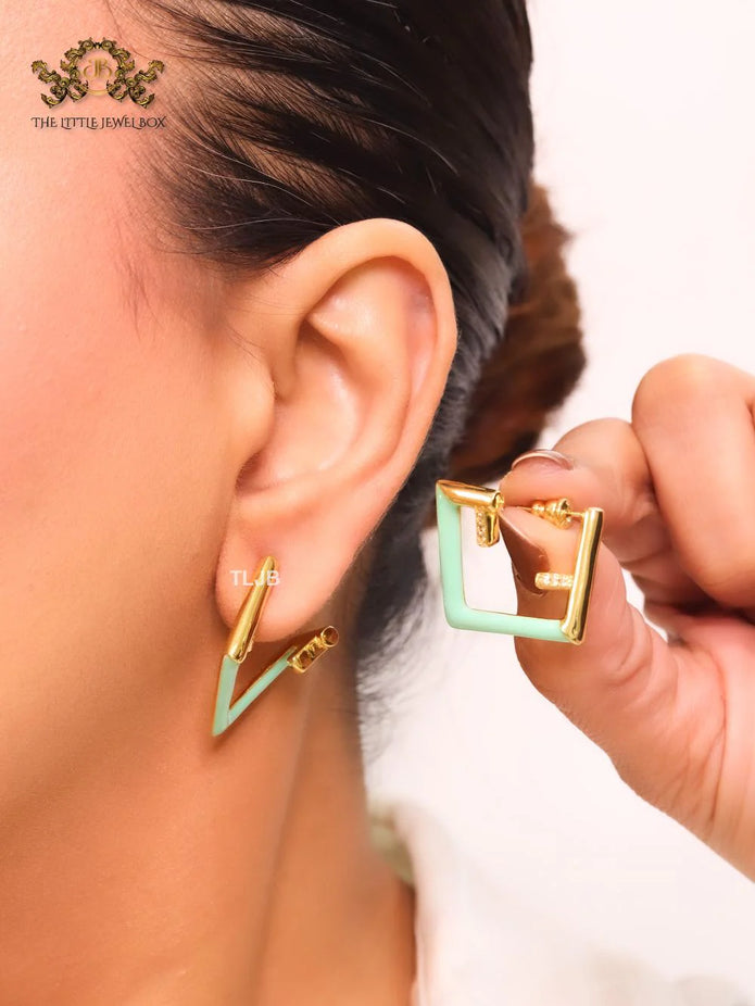 Double F & cyan enamel studs