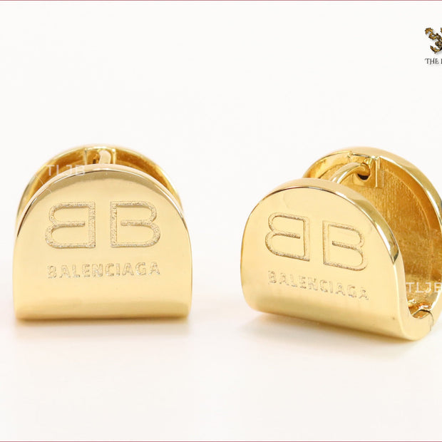 Gold double B studs