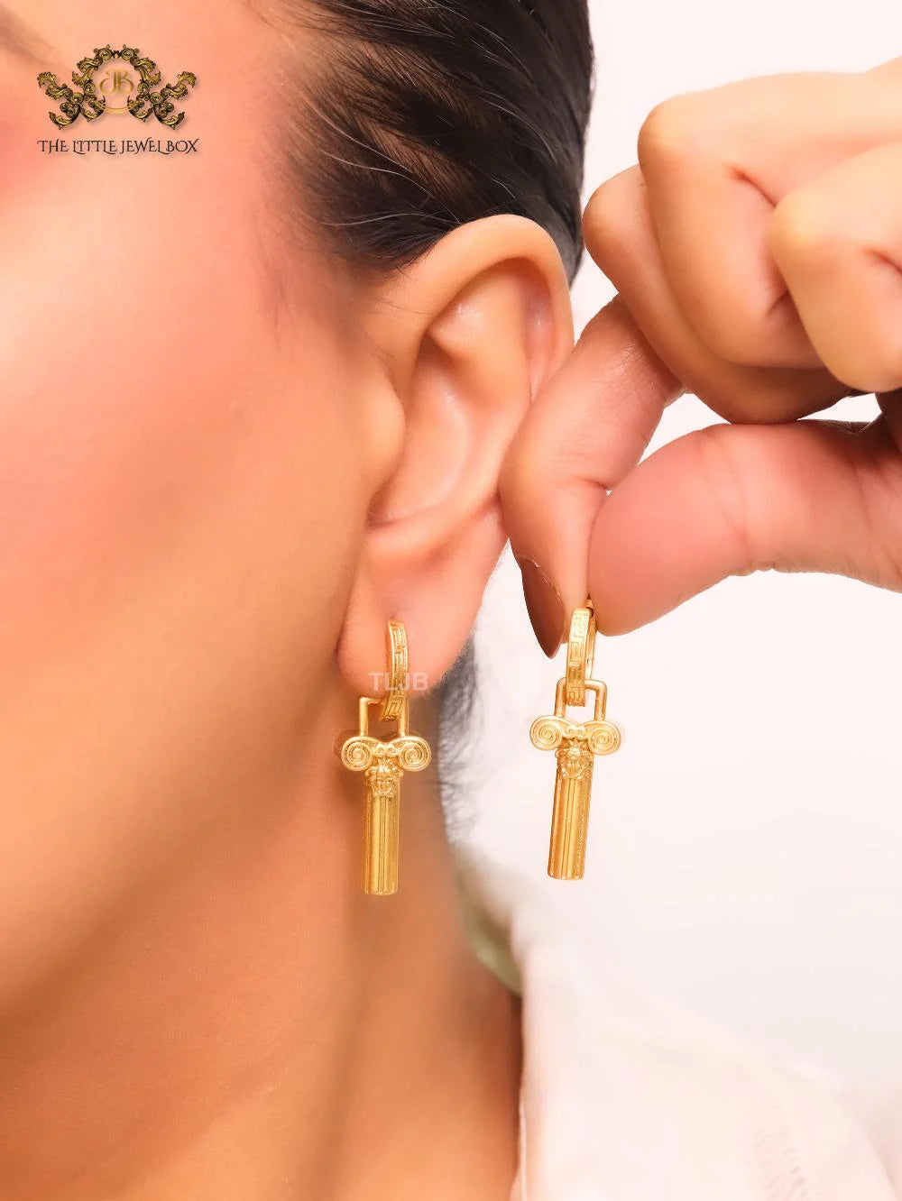 Medusa embossed gold key hoops