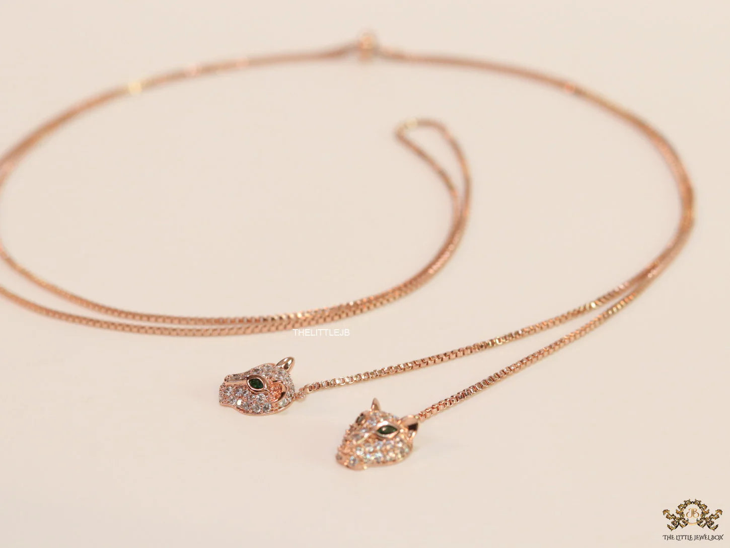 Rose gold plated knot necklace with twin cz panther pendants