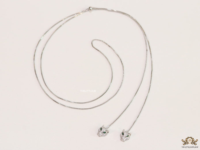 Platinum plated knot necklace with twin cz panther pendants