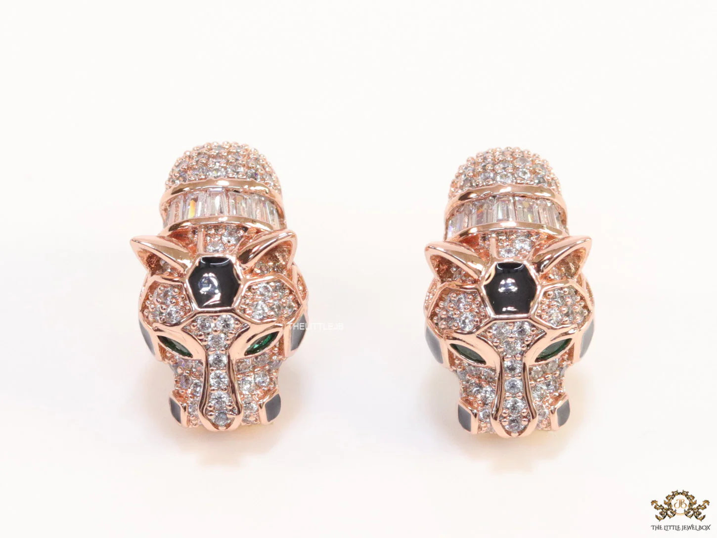 Asymmetrical cz and baguette panther studs in rose gold finish