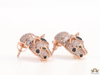 Asymmetrical cz and baguette panther studs in rose gold finish