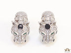 Asymmetrical cz and baguette panther studs in platinum finish
