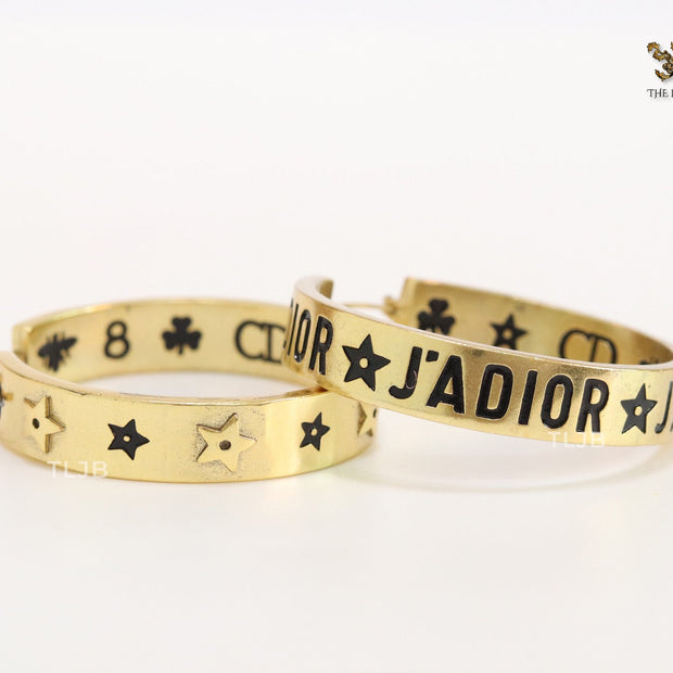 Alphabet C and D embossed on gold hoops