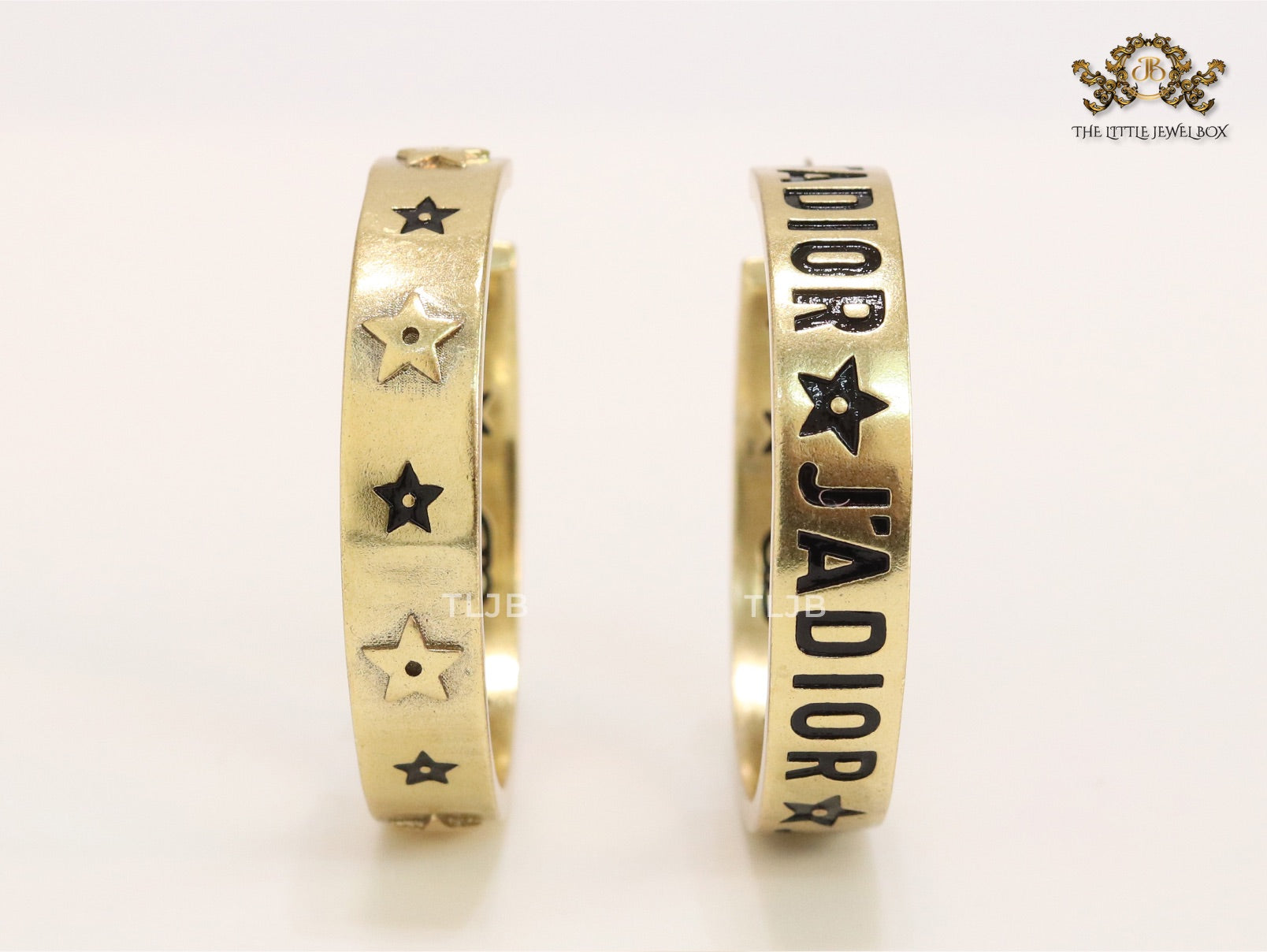 Alphabet C and D embossed on gold hoops