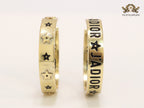 Alphabet C and D embossed on gold hoops