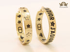 Alphabet C and D embossed on gold hoops