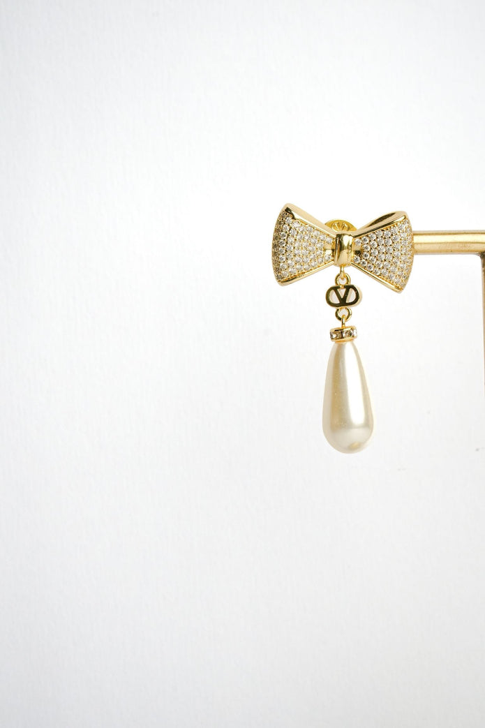 Alphabet V Bow Motif Long Pearl Dangler with CZ in Gold | Elegant Drop Earrings