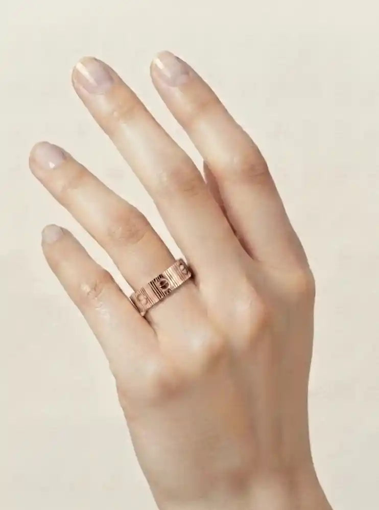 Rose gold plated screw pattern love band