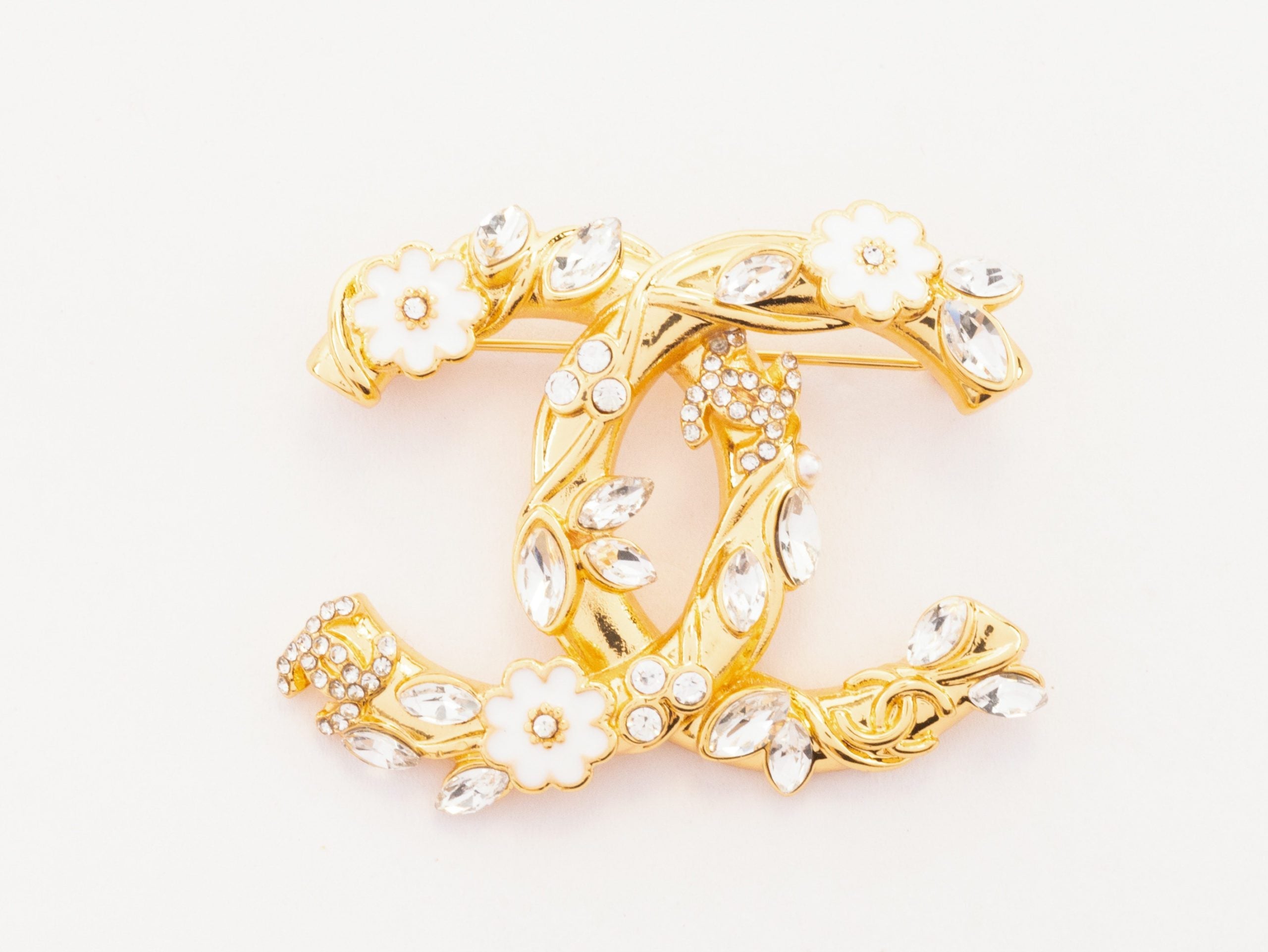 Gold Double C brooch with enamel flowers and cz leaves