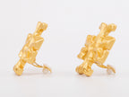 Gold earrings with T motifs matt finish clip ons