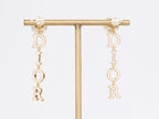 Long gold enamel alphabet C and D pearl earrings