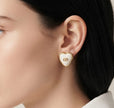 Heart shape white stud earrings with golden alphabets