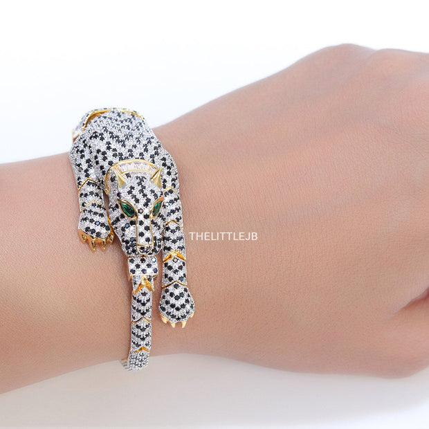 Cubic zirconia stone studded panther motif with emerald green colour stone details gold plated bracelet