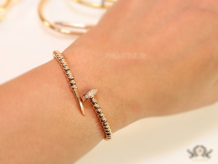 Rose gold plated cz and metallic bead nail bracelet-openable