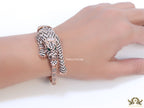 Cubic zirconia stone studded panther motif with emerald green colour stone details rose gold plated bracelet