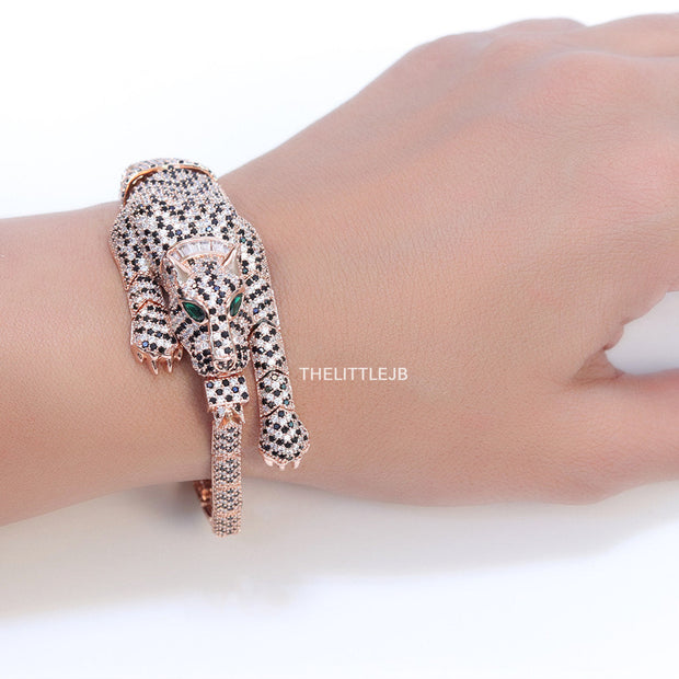 Cubic zirconia stone studded panther motif with emerald green colour stone details rose gold plated bracelet