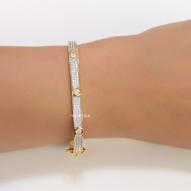 Gold plated openable bracelet studded with cz