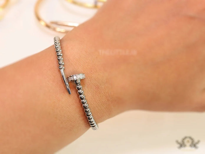 Platinum plated cz and metallic bead nail bracelet-openable