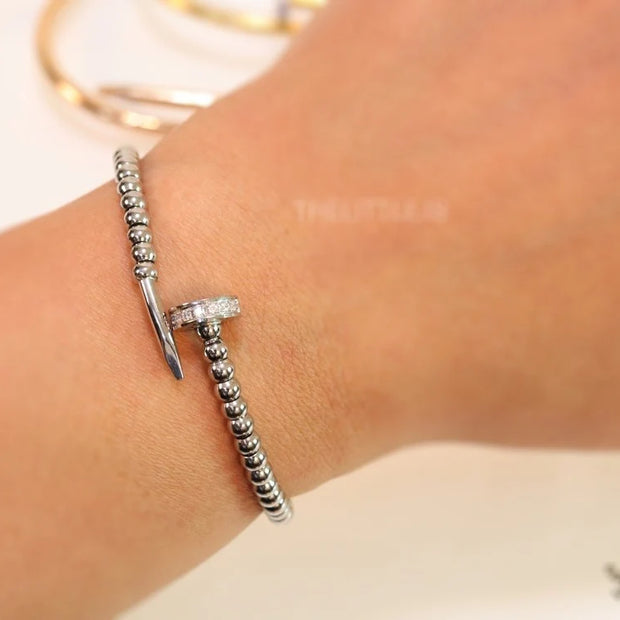 Platinum plated cz and metallic bead nail bracelet-openable