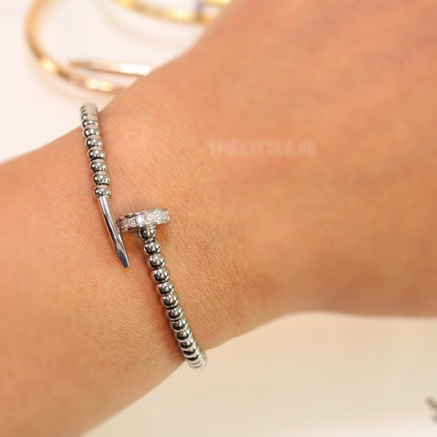 Platinum plated cz and metallic bead nail bracelet-openable