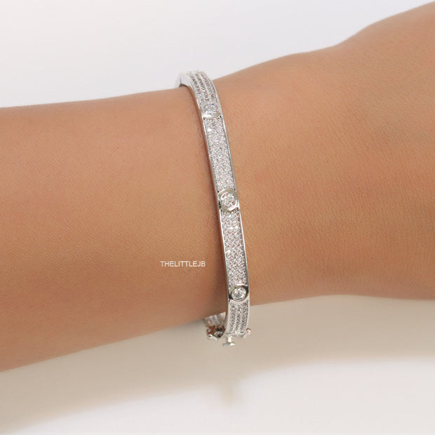 Platinum plated openable bracelet studded with cz