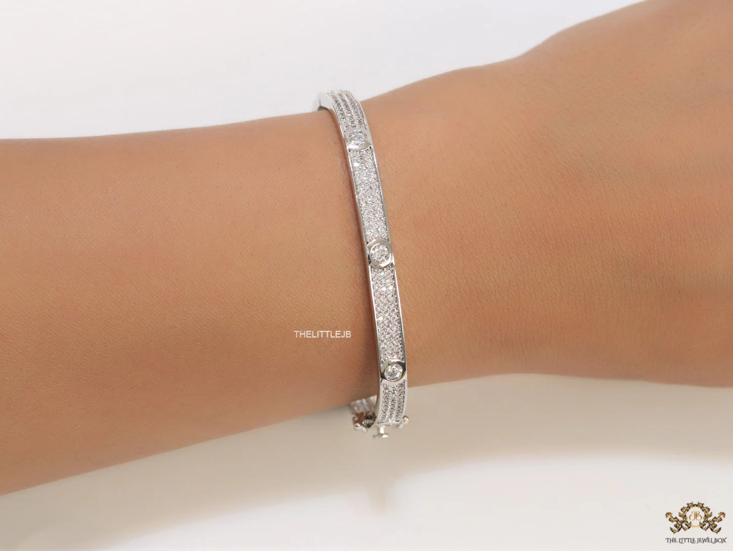 Platinum plated openable bracelet studded with cz