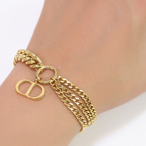 Multiple chain golden bracelet with C and D alphabets