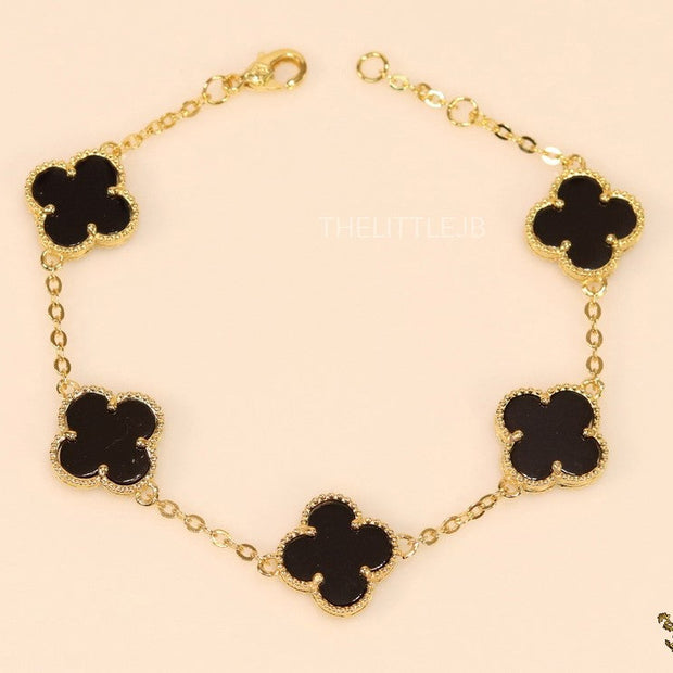 Gold plated chain bracelet with black clover