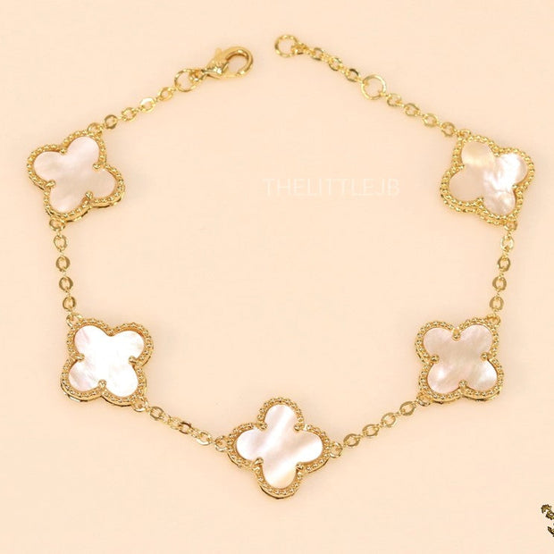 Gold plated chain bracelet with mother of pearl clover