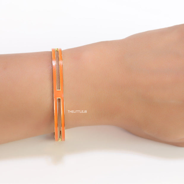 Gold plated two layer solid orange bracelet