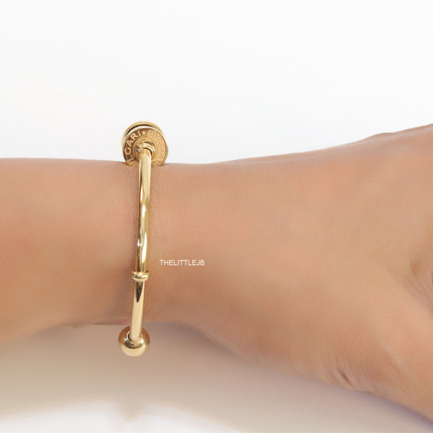 Gold plated bracelet with alphabet inscribed motif