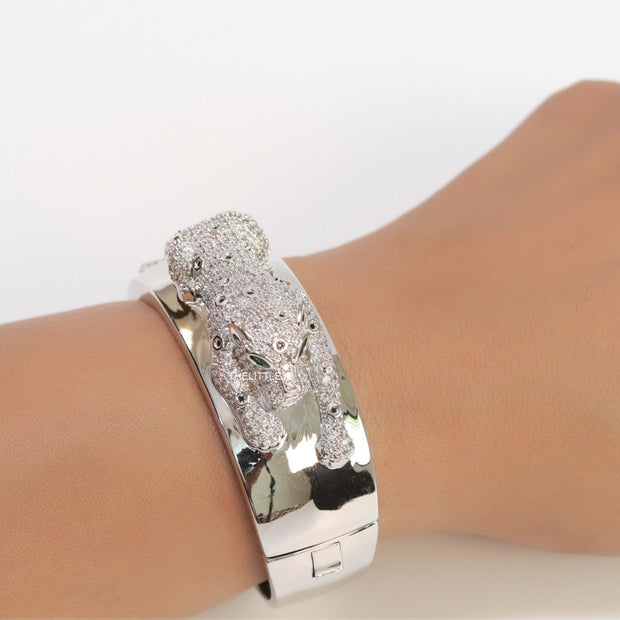 Broad band platinum bracelet with cz panther motif