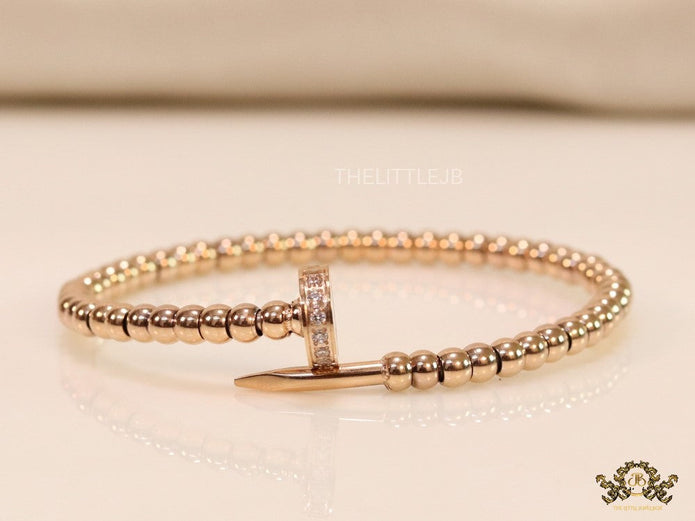 Rose gold plated cz and metallic bead nail bracelet-openable