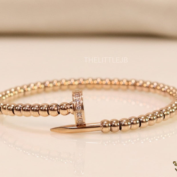 Rose gold plated cz and metallic bead nail bracelet-openable