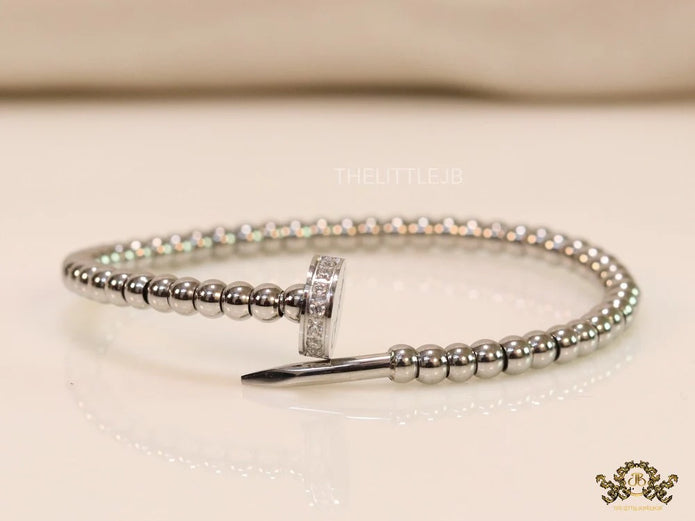 Platinum plated cz and metallic bead nail bracelet-openable