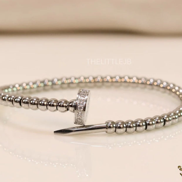 Platinum plated cz and metallic bead nail bracelet-openable