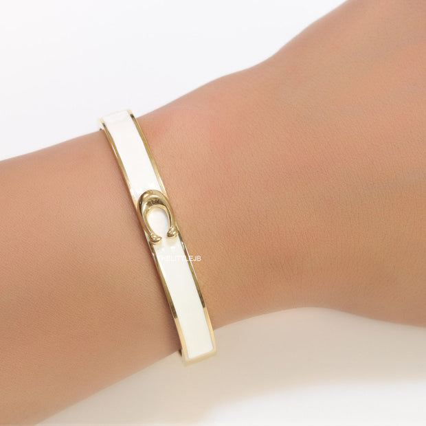 Sleek white and golden bracelet with C alphabet in centre