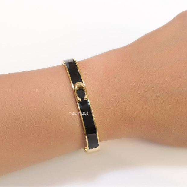 Sleek black and golden bracelet with C alphabet in centre