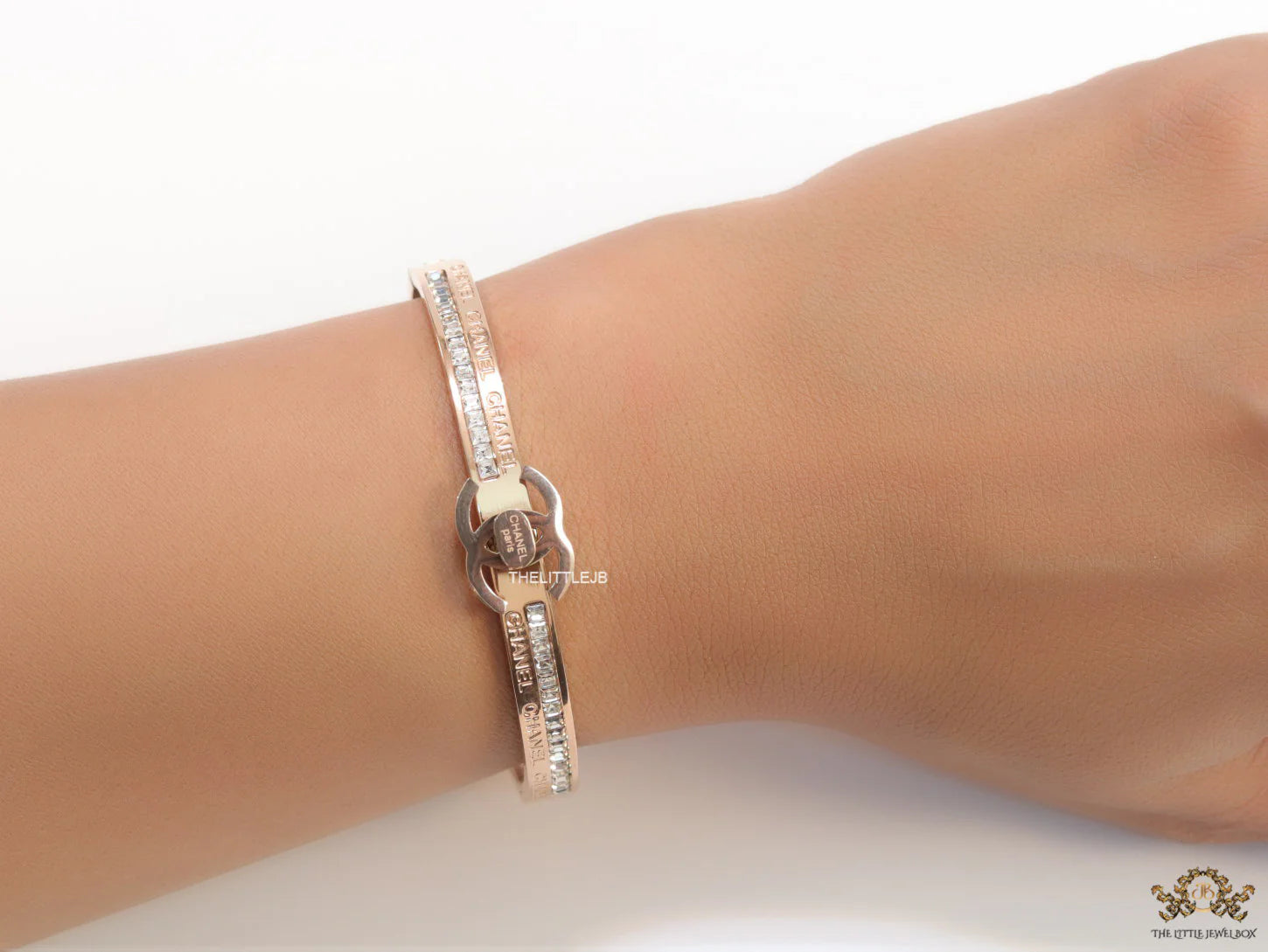 Rose gold plated bracelet with cz, inscribed alphabets and twin disc motif