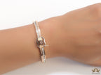 Rose gold plated bracelet with cz, inscribed alphabets and twin disc motif