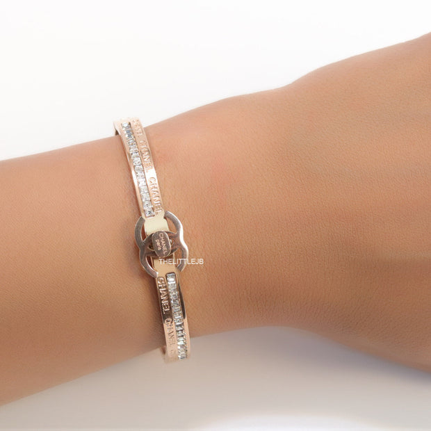 Rose gold plated bracelet with cz, inscribed alphabets and twin disc motif