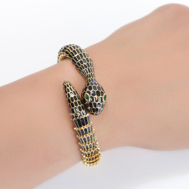 Serpentine open bracelet in black and golden finish