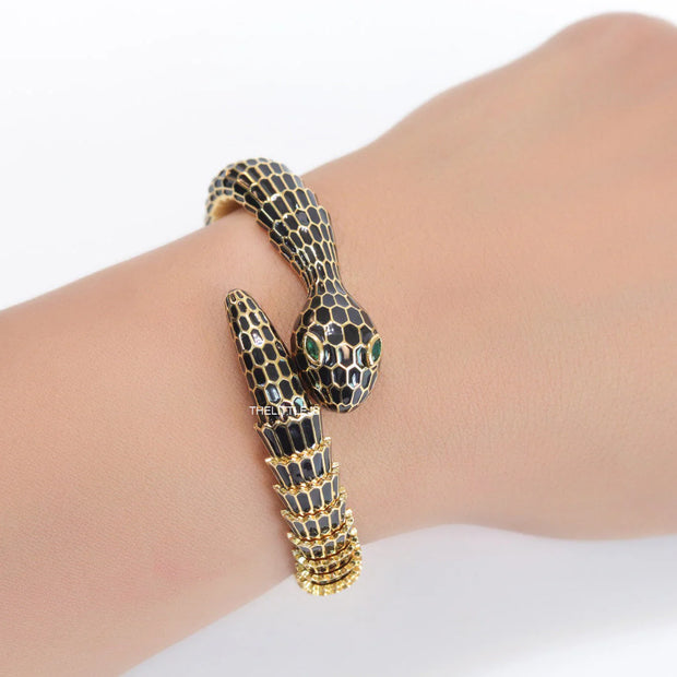 snake open bracelet in black and golden finish