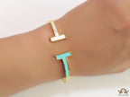 Gold plated open bracelet with blue enamel and MOP ends