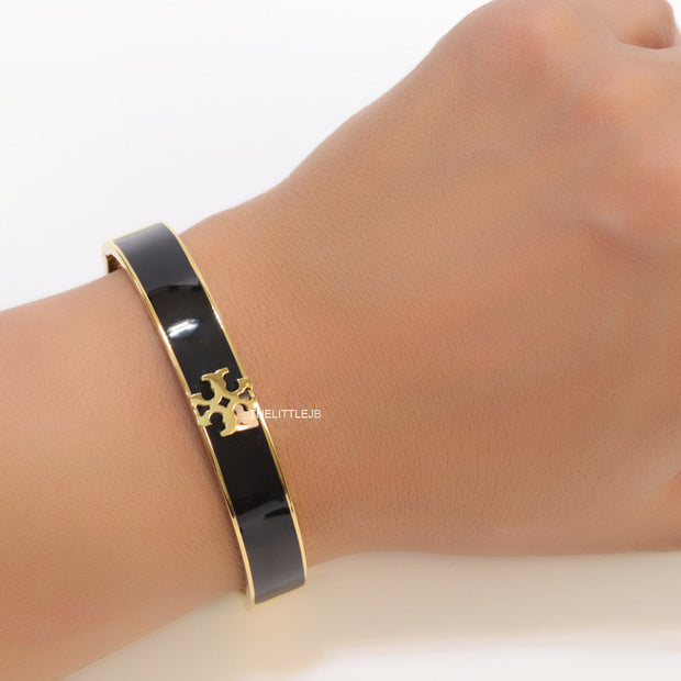 Golden and black bracelet with T motif