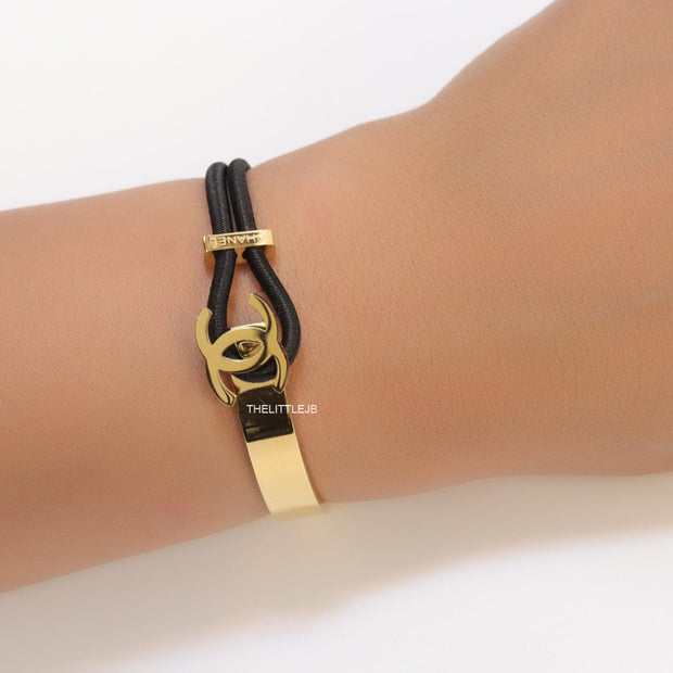 Black and golden designer bracelet with twin C motif
