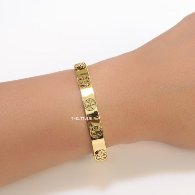 Gold plated bracelet with twin T motifs
